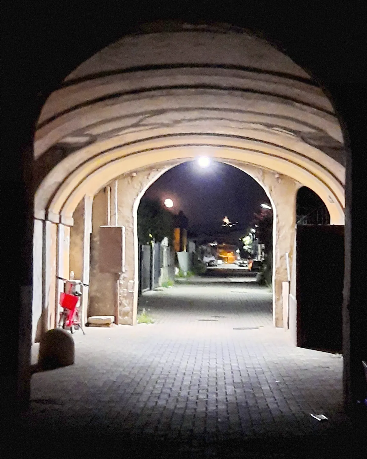 The vaulted entrance hall of the farmhouse, in the evening